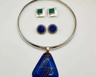 Beautiful sterling silver jewelry! A classic 5/16-inch wide Omega style Italian sterling silver chain measuring 18 inches long that can be worn alone or with the sterling silver and blue stone inlay pendant for a more dynamic look! Also shown are two pairs of sterling silver earrings, one set round with blue stone cabochons, the other square bezel set malachite stones.