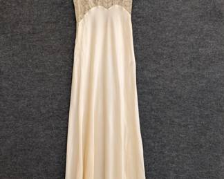 A vintage 1940s nightgown with lace accents, silk or a silk rayon mix
