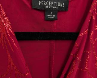 Closeup of the vintage Perceptions New York red short sleeve wrap dress, with sparkly red embroidered overall floral pattern; size S