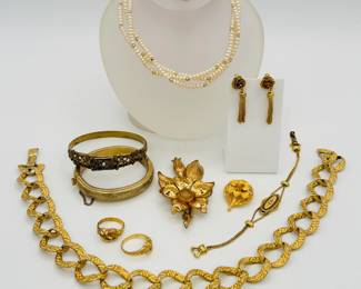 Gold tone costume jewelry necklaces, brooches, earrings, rings; faux pearl necklace and brooch