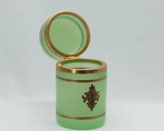 Another view of the 19th C. French Green Glass Lidded Cylindrical Jar – An antique French Green Opaline Glass petite lidded round box or jar with hinged lid, gilded fleur de lis and horizontal band decoration. 19th Century, unmarked, 2-1/2 inches W x 4-1/2 inches H.