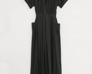 A classic Norma Kamali "Geralyn" short sleeve black jumpsuit, semi-sheer striped front and wide-leg silhouette; size 10