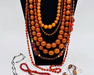 A marvelous selection of amber jewelry - glowing golden honey tones of natural amber in sterling silver pendant necklaces, chunky round graduated bead necklaces, sterling silver bracelets set with polished amber, gorgeous carved amber Chinese symbol bead necklaces, and more! 