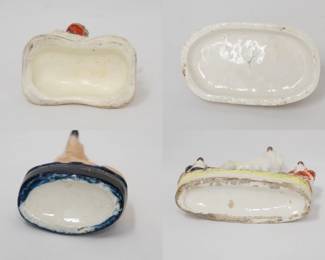 More views of the three different Staffordshire dog figurines, and an antique English Staffordshire pottery figurine of a clock group featuring a poodle and two spaniels, mid-19th century