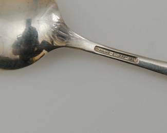 Closeup of a piece from the Stieff Rose pattern sterling silver flatware service for eight