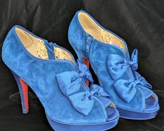 A pair of Poetic License London high heel blue suede bows open toe shoes, size 7
