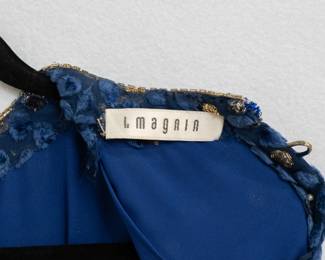 Closeup of the delightful vintage Adele Simpson navy silk evening dress embellished with gold and blue polka dots, from I. Magnin  