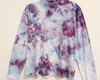 A long-sleeved tie-dye white, blue, purple and pink pullover shirt
