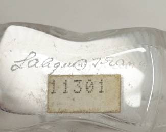 Closeup of the signed Lalique France Deux Fleurs (Two Flowers) perfume bottle in satin-finished crystal, originally designed by René Lalique in 1935