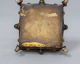 Another view of the antique jewelry or trinket box, resting on four dolphin feet, set with green hardstone cabochons and lined red with velvet