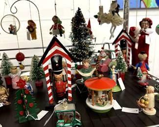 Christmas and winter holiday decorations including table top trees, hand crafted wooden ornaments