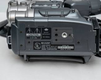 Closeup of the vintage Sharp VL-MX7 Hi8 camcorder featuring a unique twin-lens design