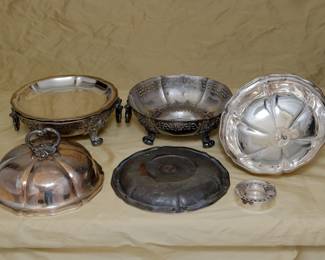 Another view of the charming pair of antique silver plated chafing dishes by Garrard's London, each with a lid, liner, base and heating element insert. Marked Garrards Panton Street London on the base. Garrard's London was opened in 1735 on Panton Street by silversmith George Wickes; Robert Garrard became a partner in 1792 and eventually took sole control in 1802; and in 1843, Queen Victoria appointed Garrard as the Crown Jeweller. This pair of antique chafing dishes pre-dates 1911 when Garrard relocated their flagship store from Panton Street to Albemarle Street (where they are still in business today.)