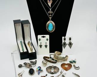 Mostly modern Mexico and native sterling jewelry including a pair of vintage Native American Zuni multi-stone inlay "Sunface" sterling silver earrings, a modernist sterling silver and amethyst pendant necklace, a sterling silver Catalina Island sailboat charm pendant necklace, a copper heart-shaped brooch, a Danecraft sterling silver bracelet, turquoise pendant necklace and bracelets, Native American artist-signed bird brooches, and lots more