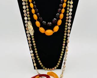 Solid amber necklaces, natural hard stone bead necklaces and some some classic Bakelite bangle bracelets