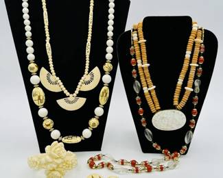 Vintage fashion jewelry including a Japanese gilt ceramic beaded necklace with matching earrings, and a celluloid cuff bracelet with elaborately carved floral design 