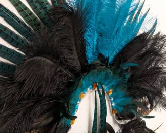 Closeup of the Carnival / Mardi Gras costume pieces consisting of a headpiece, collar, and pair of arm cuffs