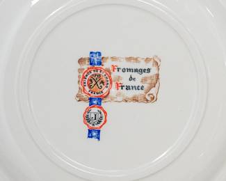 Closeup of one of the six vintage French "Fromages de France" cheese plates by Faience De St Amand, each featuring a different traditional French cheese design. 