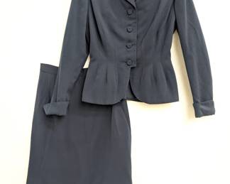 A vintage Jacobs Oregon City charcoal gray skirt suit with a fitted blazer and straight skirt
