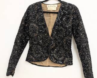 An 80's vintage Oscar de La Renta black sequined jacket; from Loretta Blum, top fashion retailer in Dallas, Texas.
