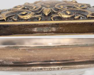 Closeup of the vintage glass trinket box with an ornate, embossed floral and scrollwork silver plated hallmarked lid, and a sterling silver and glass coaster or trinket dish