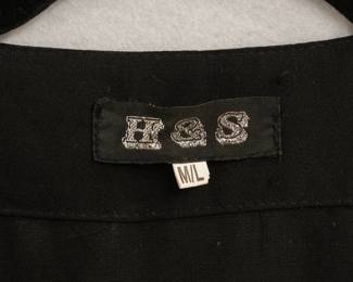 Closeup of Vintage 70's H & S black caftan with blue and gold embroidery and sequins, size M/L