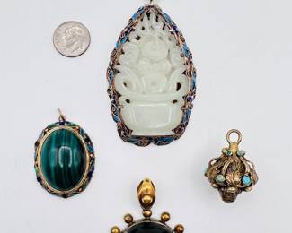 Vintage pendants including a carved jade pendant in an enamel on silver vermeil frame, a vintage gold filled banded agate mourning locket, a malachite pendant in enamel and silver vermail frame, a Victorian style turquoise "forget me not" drop charm