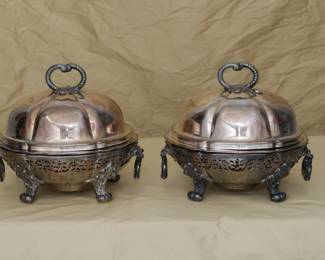 A charming pair of antique silver plated chafing dishes by Garrard's London, each with a lid, liner, base and heating element insert. Marked Garrards Panton Street London on the base. Garrard's London was opened in 1735 on Panton Street by silversmith George Wickes; Robert Garrard became a partner in 1792 and eventually took sole control in 1802; and in 1843, Queen Victoria appointed Garrard as the Crown Jeweller. This pair of antique chafing dishes pre-dates 1911 when Garrard relocated their flagship store from Panton Street to Albemarle Street (where they are still in business today.)