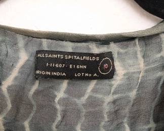 Closeup of Allsaints Spitalfields women's sheer silk tie-dye and sequins top, size 10