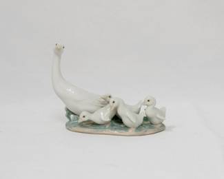 A Lladro "Little Ducks After Mother" porcelain figurine