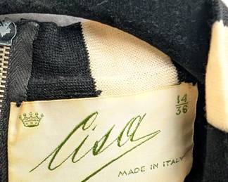 Closeup of 1960s Cisa of Italy grey wool sleeveless top and short skirt, the top with a white and gray striped scarf/tie; size 14