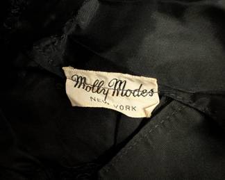 Closeup of vintage Molly Modes New York party dress, black lace, fitted bodice with halter neck