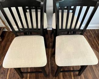 M88 - $160. Set of 4 Counter Height Stools. Measures 19" wide x 25" floor to seat x 42.5" to seat back.  They do "swivel" but its more just to get off not to swing back and forth. 