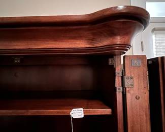 M104 - $100. Entertainment Center by Universal Furniture. Measures 59" wide x 23" deep x 69" tall. Located right inside the front door - PLEASE have help to move this. 