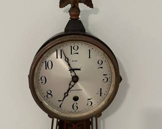 M46 - $25. Sessions Clock. Eight Day Lever Time. Mahogany Finish Case. Measures 7.5" wide x 23.5" tall. 