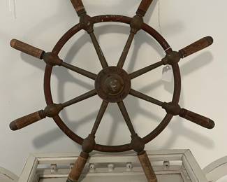 M43 - $175. 24" Ships Wheel. Brass with Wood Handles Ships Wheel with the name Gen. & Mar. Tr. Amsterdam in the middle. Measures 24" across.  