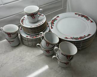 M94 - $30. Poinsettia Ribbons China. 8 Dinner plates. 8 Salad Plates. 7 cups & saucers. 