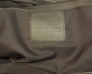 M115 - $140. Vintage COACH Black Leather Duffle Back. Measures 22" x 9" x 18". 