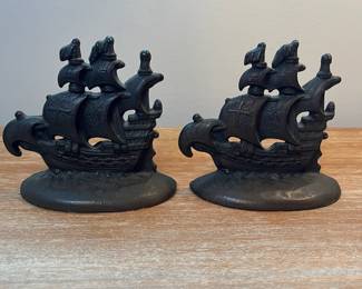M13 - $25. PAIR Galleon Bookends. Cast Iron. Measures 5" wide x 4.5" tall. 