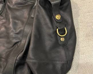 M115 - $140. Vintage COACH Black Leather Duffle Back. Measures 22" x 9" x 18". 
