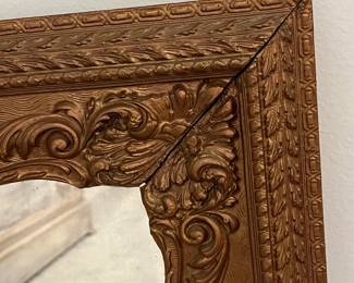M49 - $30. Antique Framed Wall Mirror. Measures 23" x 27". Currently can only be hung horizontally as photographed. Does have a few missing decorative pieces. 