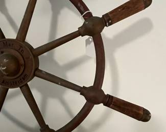 M43 - $175. 24" Ships Wheel. Brass with Wood Handles Ships Wheel with the name Gen. & Mar. Tr. Amsterdam in the middle. Measures 24" across.  