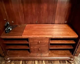 M104 - $100. Entertainment Center by Universal Furniture. Measures 59" wide x 23" deep x 69" tall. Located right inside the front door - PLEASE have help to move this. 