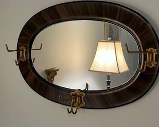 M40 - $40. Wall Mirror with Hooks. Measures 25.5" x 17.25" 