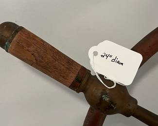 M43 - $175. 24" Ships Wheel. Brass with Wood Handles Ships Wheel with the name Gen. & Mar. Tr. Amsterdam in the middle. Measures 24" across.  