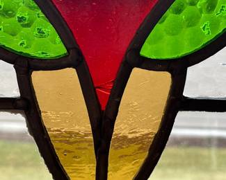 M1 - $75. Stained Glass with Hooks to Hang in the Window. Measures 20" x 14.25". One crack in a light blue pane. 