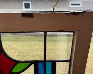 M1 - $75. Stained Glass with Hooks to Hang in the Window. Measures 20" x 14.25". One crack in a light blue pane. 