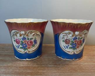 M5 - $45. PAIR Painted Cachepots. Measures 5.75" across x 4.75" tall. They do have some very minor chipping. 