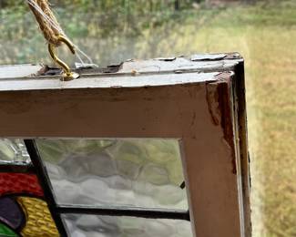 M3 - $75. Stained Glass with hooks to hang in the window. Measures 20" x 15". Has crack & hole in top center clear panel. 