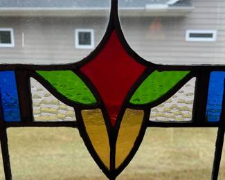 M1 - $75. Stained Glass with Hooks to Hang in the Window. Measures 20" x 14.25". One crack in a light blue pane. 